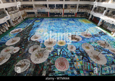 A huge collage showing a rendition of Vincent Van Gogh's masterpiece The Starry Night created by nearly 10,000 children is on display at an art festiv Stock Photo