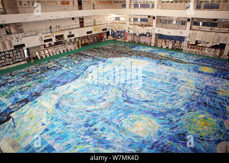 A huge collage showing a rendition of Vincent Van Gogh's masterpiece The Starry Night created by nearly 10,000 children is on display at an art festiv Stock Photo