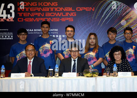 Kenneth Fok Kai-kong, center, eldest son of Hong Kong tycoon Timothy Fok Tsun-Ting, attends a press conference for the 43rd Kong Kong International Op Stock Photo