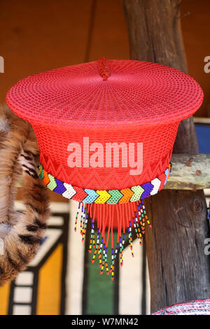 Traditional Zulu woman's red hat on display at Lesedi Cultural Village, Cradle of Humankind, South Africa Stock Photo