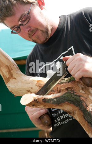 Volunteer working on wood at the Birmingham EcoPark, a Black Country Living Wildlife Trust education centre in Small Heath, West Midlands, July 2011. Model released. Stock Photo