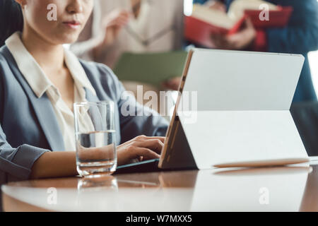 Asian business woman working on laptop Stock Photo