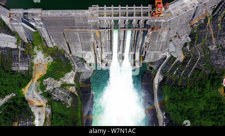 View of the Longtan hydropower station releasing water for the need of flood control along the Longtan Dam in Tian'e county, Hechi city, south China's Stock Photo