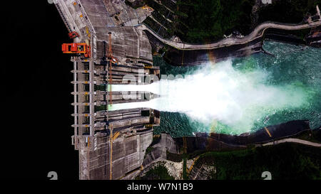 View of the Longtan hydropower station releasing water for the need of flood control along the Longtan Dam in Tian'e county, Hechi city, south China's Stock Photo