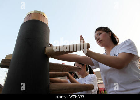Chinese office ladies practise Chinese martial art Wing Chun to improve the health at a martial art school in Chongqing, China, 12 July 2017.   More t Stock Photo