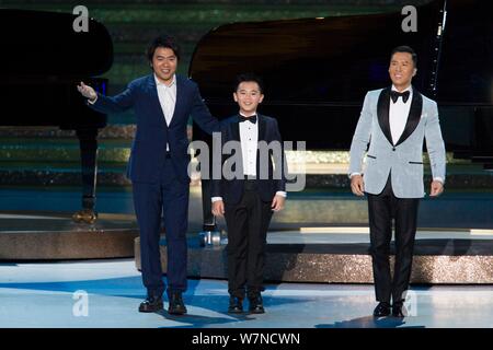 Chinese pianist Lang Lang, left, and Hong Kong actor Donnie Yen, right, perform during a grand variety show as part of the events celebrating the 20th Stock Photo