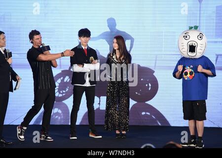 (From left) English actor Orlando Bloom, Chinese actor Wu Lei, and Taiwanese model and actress Hannah Quinlivan, the wife of singer and actor Jay Chou Stock Photo