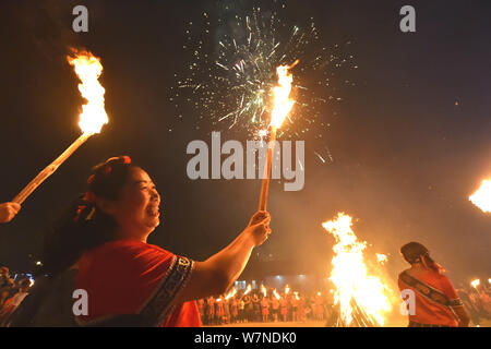 People of Yi ethnical minority gather to celebrate the Torch Festival in Dafang county, Bijie city, southwest China's Guizhou province, 17 July 2017. Stock Photo