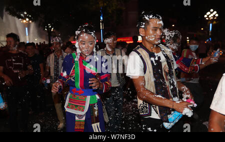 People of Yi ethnical minority gather to celebrate the 'black face' festival in Kunming city, southwest China's Yunnan province, 17 July 2017.   Touri Stock Photo
