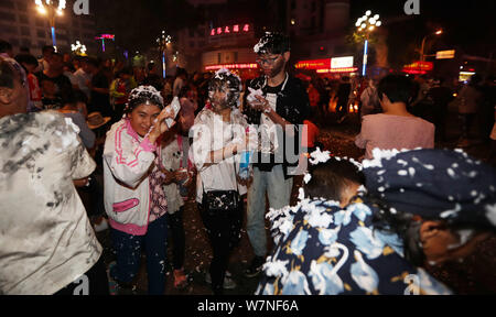 People of Yi ethnical minority gather to celebrate the 'black face' festival in Kunming city, southwest China's Yunnan province, 17 July 2017.   Touri Stock Photo