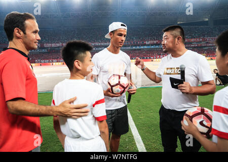Portuguese football player Cristiano Ronaldo, center, of Real Madrid, attends the opening ceremony of the match between Shanghai SIPG and Guangzhou Ev Stock Photo