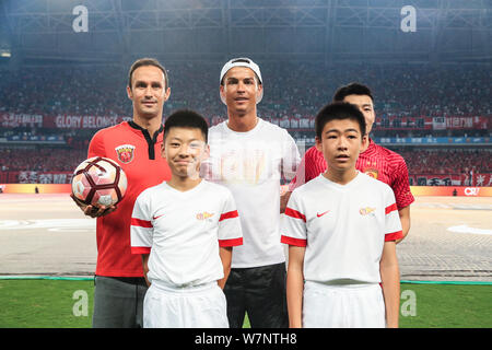 Portuguese football player Cristiano Ronaldo, back center, of Real Madrid, attends the opening ceremony of the match between Shanghai SIPG and Guangzh Stock Photo