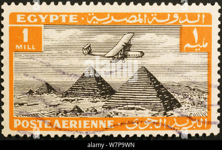 Egyptian vintage stamp with airplane flying over pyramids Stock Photo ...