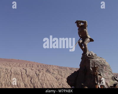 View of a sculpture of the Monkey King at the foot of the Huoyan (Flaming) Mountain in Turpan Basin, northwest China's Xinjiang Uygur autonomous regio Stock Photo