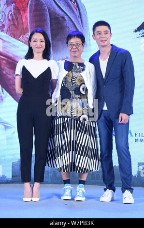 Chinese actress Zhou Xun, left, and Taiwanese actor Wallace Huo, right, attend a premiere event for their new movie 'Our Time Will Come' in Beijing, C Stock Photo