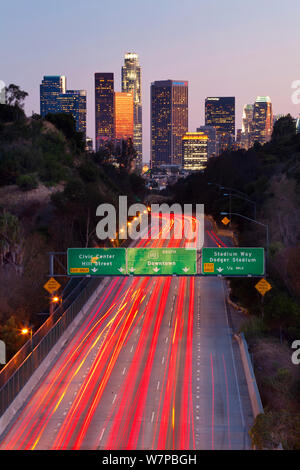 Pasadena Freeway, CA Highway 110, at dusk with light trails from cars, leading into downtown Los Angeles, California, USA, June 2011