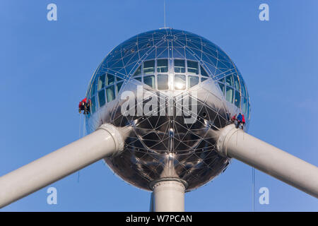 Atomium sculpture in Atomium Park, people working on the outside, Brussels, Belgium, 2006 Stock Photo
