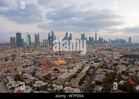 Elevated view of the new Dubai skyline of modern architecture and skyscrapers including the Burj Khalifa on Sheikh Zayed Road, Dubai, United Arab Emirates 2011 Stock Photo