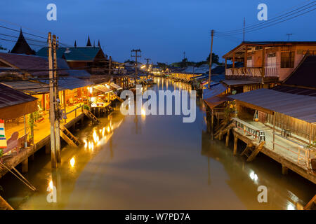 Sunrise at Amphawa floating Market and thai cultural for tourist destination. Stock Photo