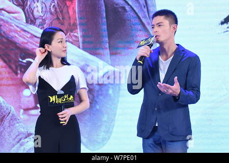 Chinese actress Zhou Xun, left, and Taiwanese actor Wallace Huo attend a premiere event for their new movie 'Our Time Will Come' in Beijing, China, 27 Stock Photo