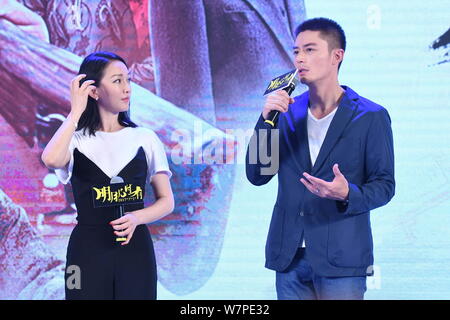 Chinese actress Zhou Xun, left, and Taiwanese actor Wallace Huo attend a premiere event for their new movie 'Our Time Will Come' in Beijing, China, 27 Stock Photo