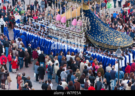 Religious float being carried through the streets during Semana Santa, Holy Week, celebrations, Malaga, Andalucia, Spain March 2010 Stock Photo