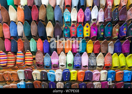Soft leather Moroccan slippers in the Souk, Medina, Marrakech, Morocco, 2011 Stock Photo