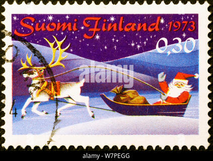 Santa Claus on his sleigh in finnish postage stamp Stock Photo