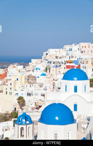 Blue domed churches in the village of Oia (La), Santorini (Thira), Cyclades Islands, Aegean Sea, Greece, 2010 Stock Photo