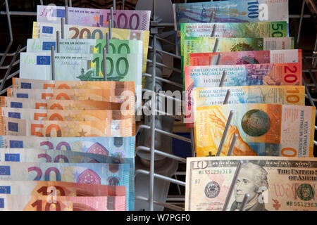 Cologne, Deutschland. 05th Aug, 2019. EURO, Swiss francs and dollar banknotes in a dishwasher | usage worldwide Credit: dpa/Alamy Live News Stock Photo