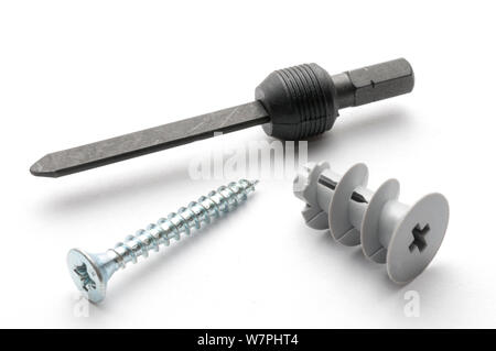 Plasterboard plug with screw and mounting accessory on white background Stock Photo