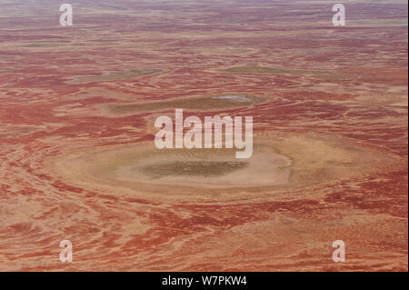 Aerial of Sturt Stoney Desert with gibber rocks. Gibber rocks are millions of years wind and water weathered chalcedonised sandstone with a hardened crust of soil cemented silica, iron and manganese, Australia. June 2011 Stock Photo