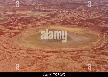 Aerial of Sturt Stoney Desert with gibber rocks. Gibber rocks are millions of years wind and water weathered chalcedonised sandstone with a hardened crust of soil cemented silica, iron and manganese, Australia. June 2011 Stock Photo