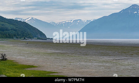 the mudflats and tide flats in turnagain arm of the cook inlet in Alaska with rugged mountains in the background Stock Photo