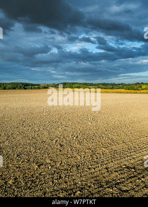 Storm clouds gathering over farmland - France. Stock Photo