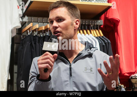 American football player Tom Brady for the New England Patriots of the National Football League (NFL) attends the opening ceremony for a new store of Stock Photo