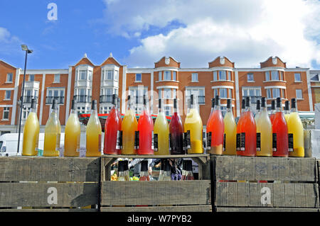 Bottles of organic juice on sale at Marylebone Farmers' Market, London, England UK, March 2009 Stock Photo