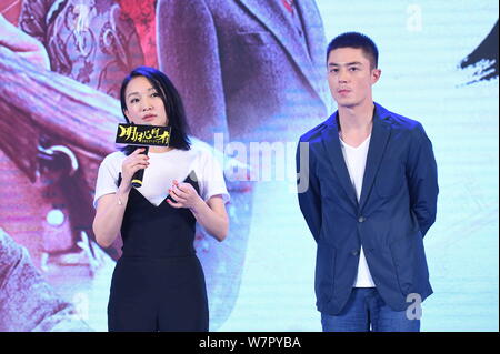 Chinese actress Zhou Xun, left, and Taiwanese actor Wallace Huo attend a premiere event for their new movie 'Our Time Will Come' in Beijing, China, 27 Stock Photo