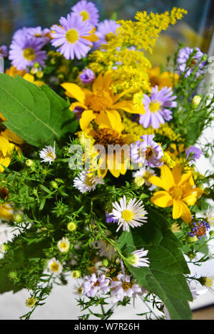 Flower bouquet of beautiful wild Ukrainian wildflowers made with a soul from the steppe part of Ukraine. Stock Photo