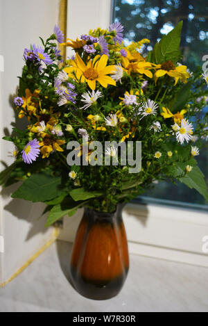 Flower bouquet of beautiful wild Ukrainian wildflowers made with a soul from the steppe part of Ukraine. Stock Photo