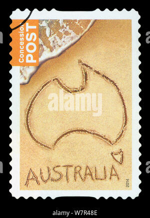 AUSTRALIA - CIRCA 2014: a stamp printed in the Australia shows Map of Australia in the sand, Australia Day, circa 2014. Stock Photo