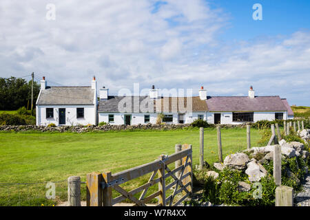 Row of traditional Welsh quaint old cottages. Moelfre, Isle of Anglesey (Ynys Mon), north Wales, UK, Britain Stock Photo