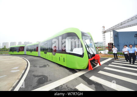 The world's first railless train, developed by the CRRC Zhuzhou Institute Co. Ltd, runs on a road in Zhuzhou city, central China's Hunan province, 2 J Stock Photo