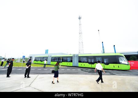 The world's first railless train, developed by the CRRC Zhuzhou Institute Co. Ltd, runs on a road in Zhuzhou city, central China's Hunan province, 2 J Stock Photo