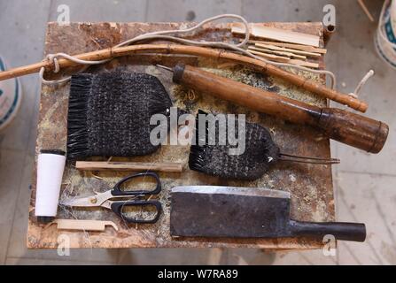 View of the tools to make oil paper umbrellas at the stuidio of Yu Wanlun, the seventh generation successor of Luzhou's oil paper umbrella, in Hangzho Stock Photo