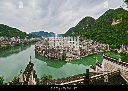 Old houses are seen along the Wuyang River in Zhenyuan ancient water town in Qiandongnan Miao and Dong Autonomous Prefecture, southwest China's Guizho Stock Photo