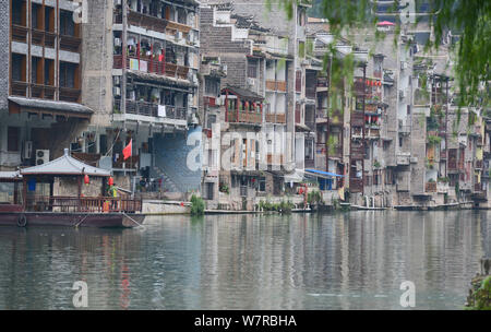 Old houses are seen along the Wuyang River in Zhenyuan ancient water town in Qiandongnan Miao and Dong Autonomous Prefecture, southwest China's Guizho Stock Photo