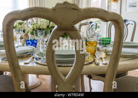 View through dining chair of set table Stock Photo