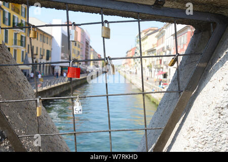 Italy, Lombardy, Milan, Naviglio Grande Canal, Padlock with Heart Shape attached to Bridge Stock Photo