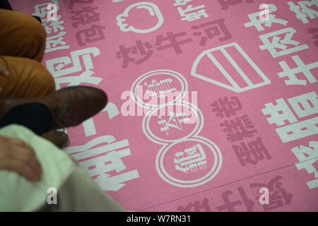 Chinese words collected from commuters are pictured in a subway train featuring pink decorations to encourage people to declare their feelings in Shen Stock Photo